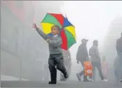  ?? DEEPAK SANSTA/HT ?? A child enjoys the downpour on the Mall Road in Shimla on Thursday.