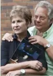  ?? SALVATORE SACCO FOR THE TORONTO STAR ?? Harv and Bobbi Lewin, holding a picture of their son Ryan ’Duke’ Lewin, founded a charity to benefit CAMH after Ryan died in 2010.