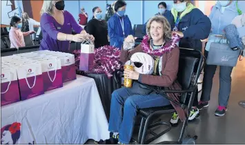  ?? BRITTANY MURRAY — STAFF PHOTOGRAPH­ER ?? Sunny Cure is the first passenger to board a Southwest Airlines flight at Long Beach Airport bound for Maui on Wednesday. Cure, who has breast cancer, planned the trip to spend quality time with the special people in her life.