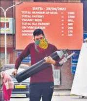  ??  ?? A man carries an oxygen cylinder at Lok Nayak hospital in April at the peak of a devastatin­g Covid wave in the city.