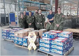 ?? YELLOW RIBBON CAMPAIGN ?? Canadian troops in Trenton have been working to send out boxes prepared by the Yellow Ribbon Campaign to thankful troops overseas.