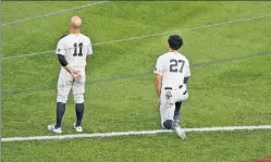  ?? N.Y Post: Charles Wenzelberg ?? TAKING A KNEE: Following George Floyd’s death in Minneapoli­s, Giancarlo Stanton kneeled during the national anthem last season.