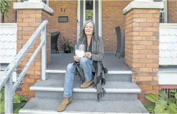  ?? BOB TYMCZYSZYN/POSTMEDIA NEWS ?? Helena Rocca with a photo of her 88-year-old father. She is organizing a focus group for improvemen­ts to end of life care. The house on Albert Street in St. Catharines was a place that gave her father comfort and peace in his life. Helena lived with...