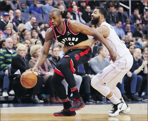  ?? PABLO MARTINEZ MONSIVAIS/AP ?? Raptors forward Serge Ibaka (left) goes around Wizards forward Markieff Morris. The Raptors are 3.5 games up on the Celtics.