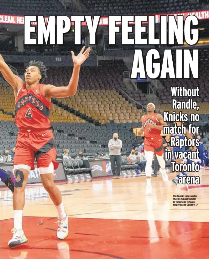  ?? AP ?? Obi Toppin (goes up for shot as Knicks tumble to Toronto in virtually empty arena Sunday.