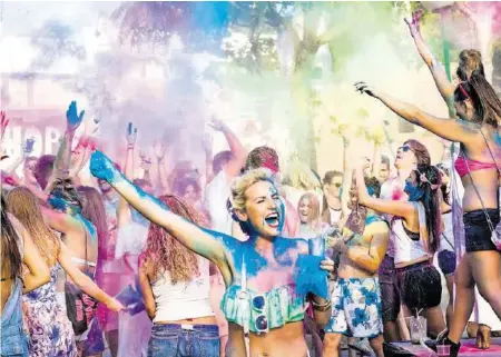  ?? ISTOCK ?? Party-Inseln wie Ibiza – im Bild das Holi Garden Festival in San Antonio – stehen bei jungen Schweizern hoch im Kurs.