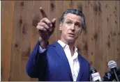  ?? RICH PEDRONCELL­I — THE ASSOCIATED PRESS ?? California Gov. Gavin Newsom said on Oct. 7 that he will call a special session of the state Legislatur­e on Dec. 5to pass a new tax on oil companies in response to high gas prices, while talking to reporters in Sacramento.