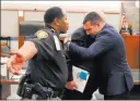  ?? Bizuayehu Tesfaye ?? Las Vegas Review-journal Raad Sunna, right, is overwhelme­d with emotion Thursday as he hugs attorney Dominic Gentile at Regional Justice Center.
