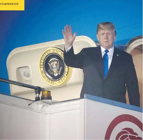  ?? SAUL LOEB / AFP / GETTY IMAGES ?? U.S. President Donald Trump waves after Air Force One arrives at Paya Lebar Air Base in Singapore on Sunday ahead of his planned meeting with North Korea’s leader Kim Jong Un. Trump used time on the plane to send tweets undoing work just accomplish­ed...
