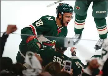  ?? AP PHOTO/ANDY CLAYTON-KING ?? Minnesota Wild left wing Jordan Greenway (18) celebrates a goal against the Winnipeg Jets in the second period of Game 3 of an NHL first-round hockey playoff series Sunday in St. Paul, Minn.