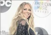  ?? JORDAN STRAUSS — INVISION/AP ?? Mariah Carey, here at the American Music Awards in L.A. in 2018, once again is riding the Christmas wave. Carey’s classic song “All I Want for Christmas” is so popular it set a new one-day streaming record on Spotify.