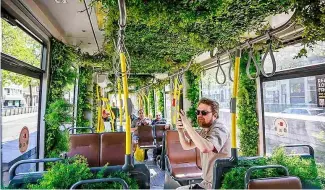  ?? ?? The car running on line 1 had been transforme­d into a lush mobile garden for a day, with plants squeezed into every available space.