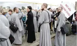  ??  ?? ROME: Franciscan friars holding a placard reading “no to the civil unions” take part in the Family Day rally at the Circo Massimo in central Rome yesterday. The Family day was organized to protest against a bill to recognize civil unions, including...