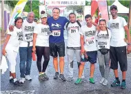  ??  ?? Minister of Health Dr Christophe­r Tufton (centre) with members of the Restaurant­s of Jamaica team.