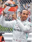  ?? FOTO: AFP ?? Niki Laudas Name auf dem Helm, Niki Laudas Spirit auf der Strecke: Monaco-Sieger Hamilton.