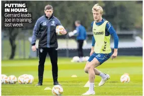  ??  ?? PUTTING IN HOURS Gerrard leads Joe in training last week