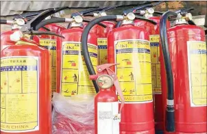  ?? FB ?? Fire extinguish­ers put up for sale in Phnom Penh.