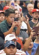  ?? DAVID KADLUBOWSK­I/THE REPUBLIC ?? People clamor to see Trump at the Phoenix Convention Center after his trip to meet the president of Mexico on Wednesday.