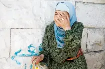  ??  ?? A woman mourns during the funeral of Nawaf Infiaat, a 16-year-old Palestinia­n girl, who was killed by Israeli soldiers, in the northern West Bank town of Yaabad on Saturday. (AFP)