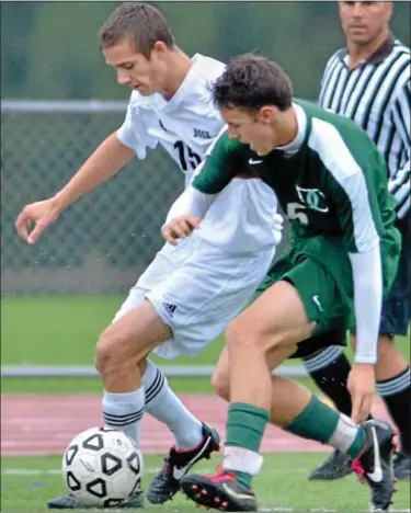  ?? For Montgomery Media / MARK C. PSORAS ?? Christophe­r Dock’s Logan Hunsberger works a ball around a Delco Christian defender during Tuesday’s Bicentenni­al League action.