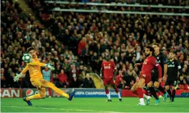  ??  ?? Mohamed Salah scores Liverpool’s winning goal against RB Salzburg. Photograph: Peter Powell/EPA