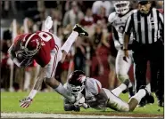  ?? Arkansas Democrat-Gazette file photo ?? Arkansas linebacker Gabe Richardson tackles Alabama receiver DeVonta Smith during Arkansas’ 41-9 loss at Alabama in October. Richardson is switching to defensive end, where he is currently working with the first-team defense.