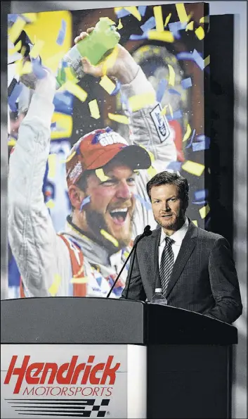  ?? MIKE COMER / GETTY IMAGES ?? Dale Earnhardt Jr. said at Tuesday’s announceme­nt he hopes to continue to work in racing after he retires as a driver. “I don’t have to be the guy holding the trophy,” he said, “but being a part of that success, I really enjoy.”