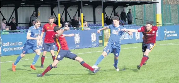  ??  ?? Alex Darlington (blue) on the attack for Bangor against Cardiff Met. Pic: Kevin Owen (Bangor City FC Media)