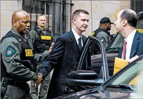  ?? JIM LO SCALZO/EPA ?? Baltimore Officer Edward Nero, center, leaves the courthouse after his verdict Monday.