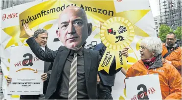  ?? Picture: Emmanuele Contini/NurPhoto via Getty Images ?? An activist dressed as Amazon CEO Jeff Bezos at a demonstrat­ion in Berlin last year by Amazon workers, trade union members and activists. The demonstrat­ors, from countries such as Poland and Spain, were protesting against work exploitati­on and poor working conditions at Amazon.