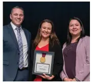  ??  ?? Above: Rob Imrie, Sarah Pashagumsk­um, and Chantal Mianscum represent the Aanischaau­kamikw Cree Cultural Institute, which received the Excellence in Museums: History Alive! award.