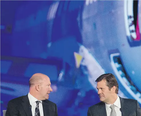  ?? GRAHAM HUGHES FOR NATIONAL POST ?? Bombardier CEO Alain Bellemare, left, and Pierre Beaudoin at a company annual meeting last year. Beaudoin will step down as executive chairman in June but will remain as non- executive chair following an outcry over a compensati­on plan that was...