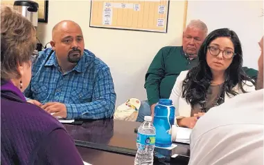  ?? MARK OSWALD/JOURNAL ?? Andrea Romero, right, and Santa Fe County Commission­er Henry Roybal, left, at a March meeting of the Regional Coalition of LANL Communitie­s.