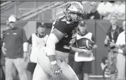  ?? Cliff Grassmick / Staff Photograph­er ?? Mustafa Johnson scores a touchdown against CSU on Aug. 30, 2019 at Empower Field at Mile High in Denver.