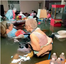  ??  ?? A dramatic photo showing elderly residents of a Texas nursing home sitting in floodwater­s, waiting to be rescued has gone viral. The shocking scene came as Tropical Storm Harvey caused widespread flooding across the state, inundating homes and...