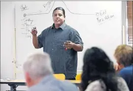  ?? K.C. Alfred San Diego Union-Tribune ?? THE GOVERNOR sees online learning as more cost-effective than traditiona­l education. Above, Ral Christman teaches history at a community college in 2017.