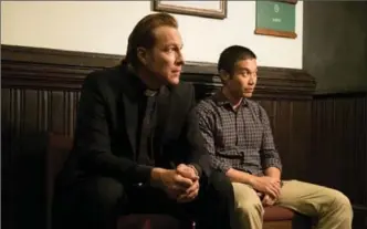  ?? COURTESY OF SONY ?? The Rev. Michael Spurlock (played by John Corbett) with Ye Win (played by Nelson Lee) await a decision about the future of their church in the new movie “All Saints.”