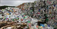  ?? RNZ/NINA FOWLER ?? Bales of mixed plastic wait for export at Wellington’s recycling facility at Seaview, New Zealand.