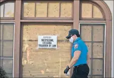  ?? Francine Orr Los Angeles Times ?? A SIGN WARNS against trespassin­g in the El Sereno neighborho­od of L. A., where would- be occupiers continue to eye vacant houses.