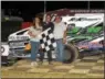  ?? RICK KEPNER - FOR DIGITAL FIRST MEDIA ?? Kyle Lilick, center, is joined by his parents in victory lane after his feature win on June 10at Grandview Speedway.