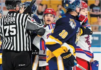  ?? TIFFANY LUKE KITCHENER RANGERS PHOTO ?? Kitchener Rangers winger Antonino Pugliese, middle, gets tangled up against the Erie Otters earlier this season. The teams will renew hostilitie­s Friday night for Game 1 of their quarterfin­al series.