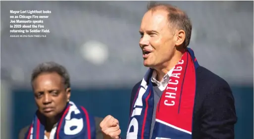  ?? ASHLEE REZIN/SUN-TIMES FILE ?? Mayor Lori Lightfoot looks on as Chicago Fire owner Joe Mansueto speaks in 2019 about the Fire returning to Soldier Field.