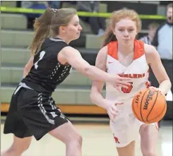  ?? Scott Herpst ?? Lafayette’s Sara Pendley looks to get by Ridgeland’s Lexie Young during Saturday’s Walker County battle. The Lady Ramblers moved to 4-1 on the season with the win.