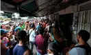  ??  ?? People queue to buy food at Petare neighborho­od in Caracas on Sunday during a massive power outage. Photograph: Juan Barreto/AFP/Getty Images