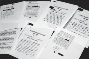  ?? Associated Press ?? ■ A sample of classified Chinese government documents leaked to a consortium of news organizati­ons is displayed Friday in New York. Beijing has detained more than a million Uighurs, ethnic Kazakhs and other Muslim minorities for what it calls voluntary job training. The confidenti­al documents lay out the Chinese government's deliberate strategy to lock up ethnic minorities to rewire their thoughts and even the language they speak.