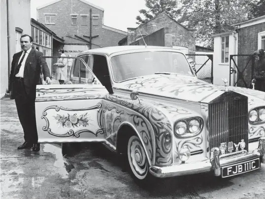  ?? GETTY ?? Chauffeur Les Anthony beside John Lennon’s psychedeli­c Rolls-Royce in 1967.
