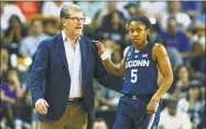  ?? Reinhold Matay / Associated Press ?? UConn’s Crystal Dangerfiel­d talks to coach Geno Auriemma on Sunday in Orlando, Fla.