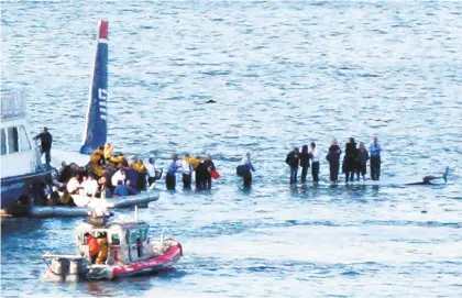  ?? BEBETO MATTHEWS/ASSOCIATED PRESS FILE PHOTO ?? Ten years ago this week, passengers were rescued from a US Airways jet that landed on the Hudson River after striking geese on takeoff from New York City's LaGuardia Airport. It was dubbed the ‘Miracle on the Hudson.'