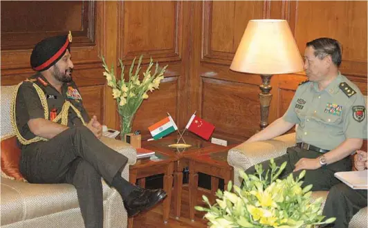  ??  ?? Deputy Chief of General Staff (Operations), PLA China, Lt. General Qi Jianguo meeting the
Chief of Army Staff, General Bikram Singh in New Delhi