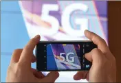  ?? ARNE DEDERT — GETTY IMAGES ?? Arcata is considerin­g its approach to allowing for 5G technology to be on public property, now allowable under FCC rules.